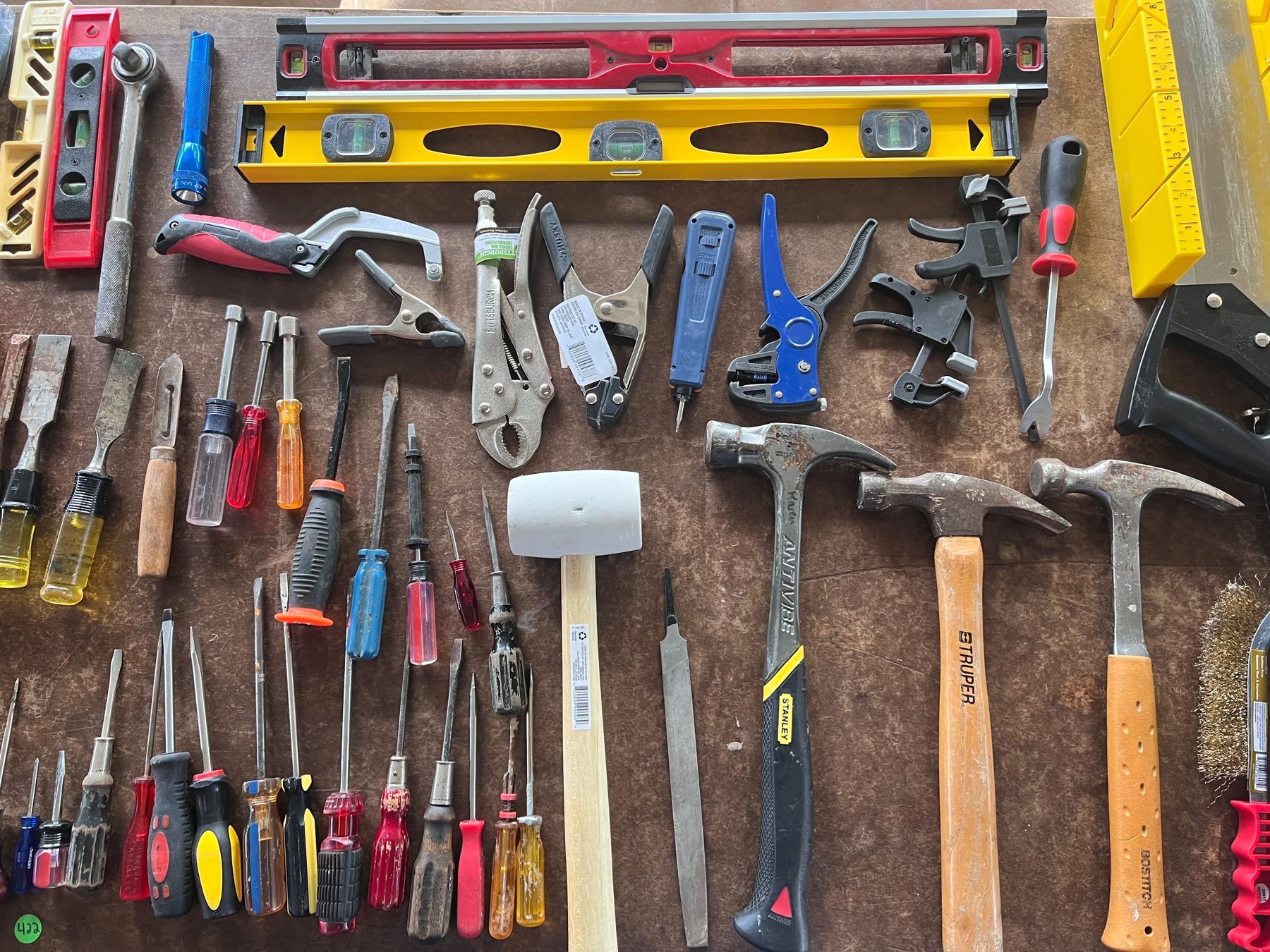 Hand tools arranged on a worktable